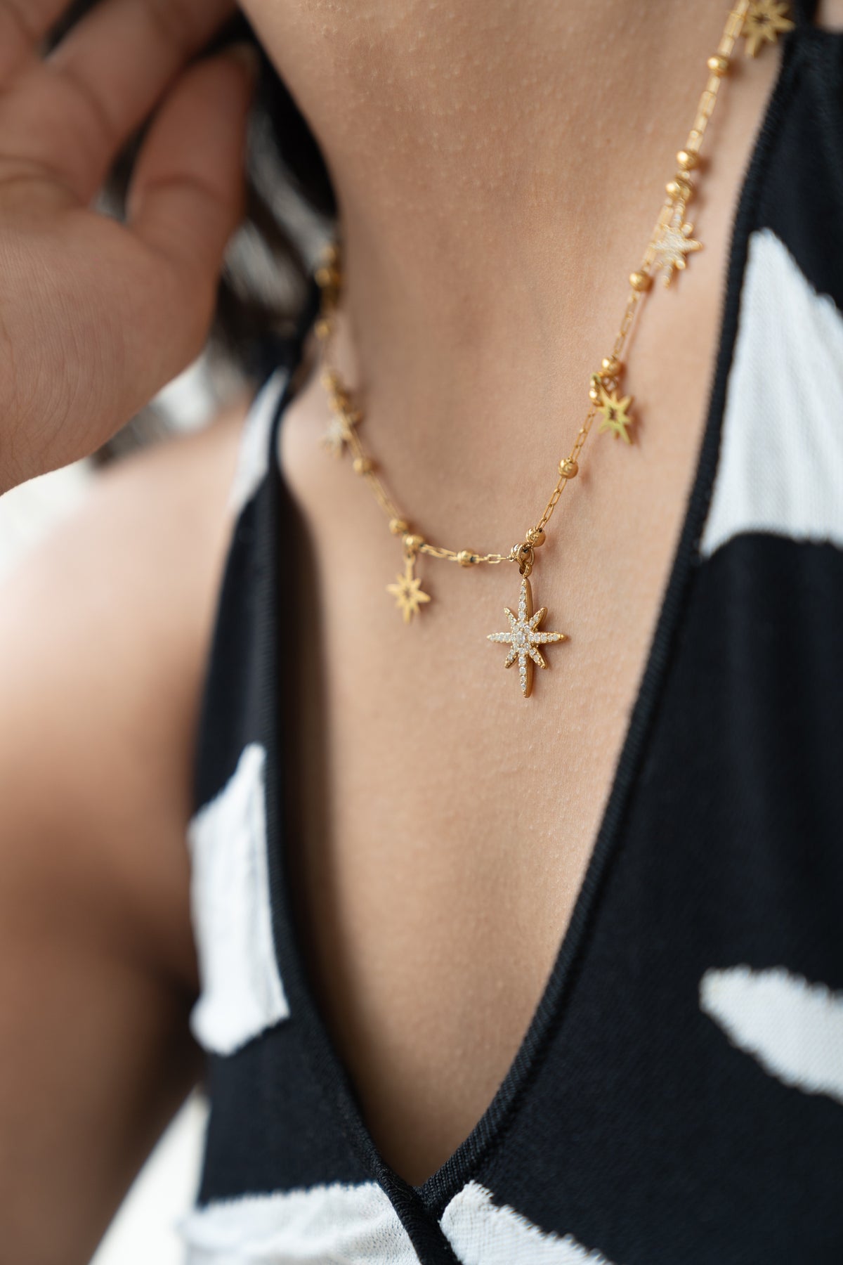 Celestial Star Necklace by MHAARO, Gold Multi Starburst Charms